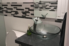Modern sink installation and tiling after bathroom renovation